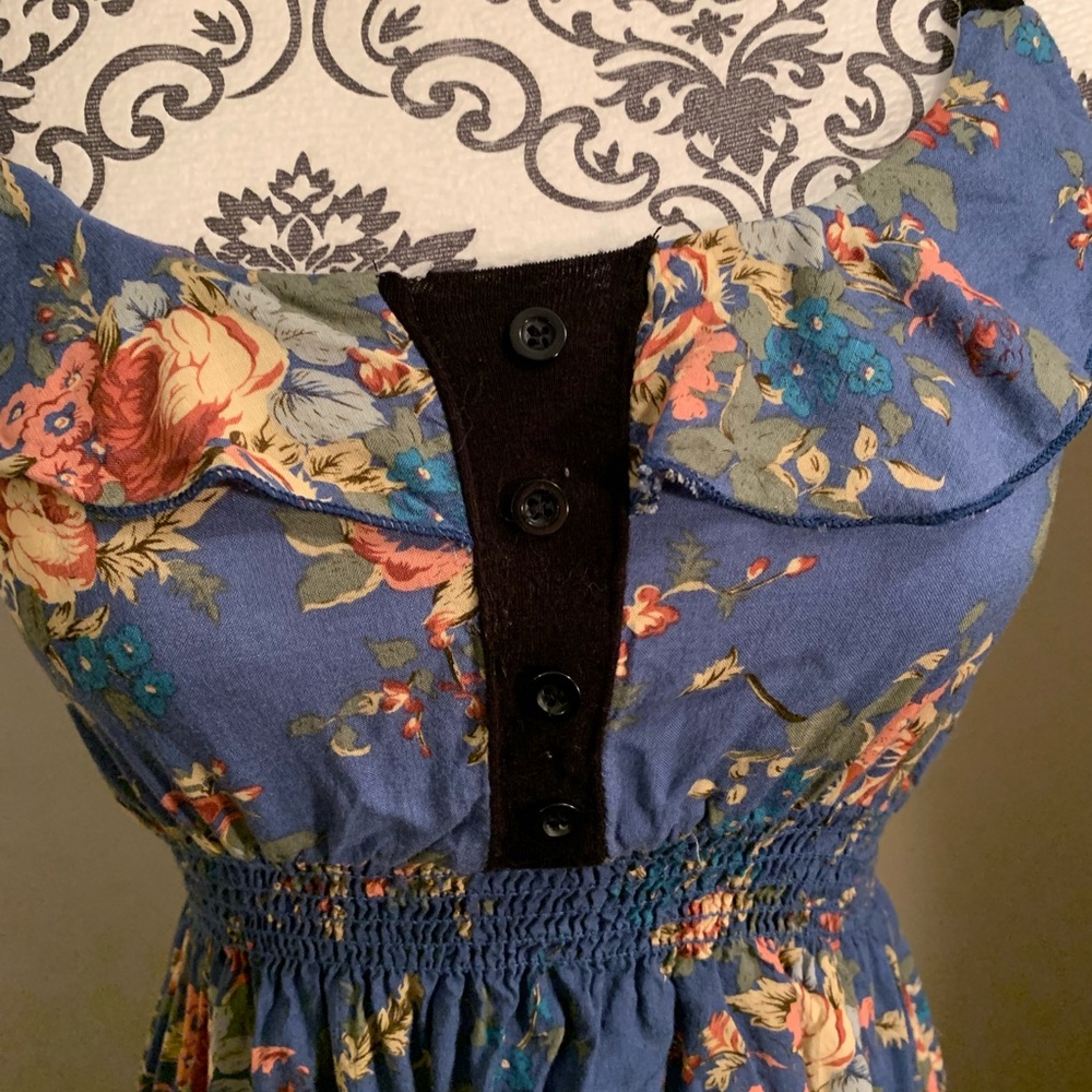 Color swatch blue floral dress with black trim.
